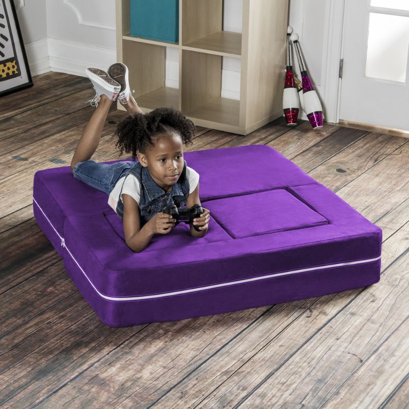Jaxx Zipline kids convertible loveseat in purple microsuede in bed mode, a fold out play sofa for lounging and play