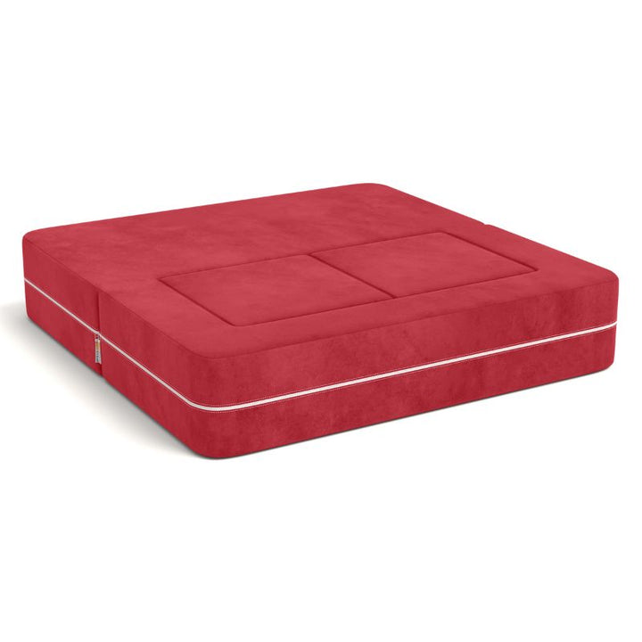 Jaxx Zipline kids convertible loveseat in red microsuede folded into bed mode, a fold out sofa that doubles as a daybed