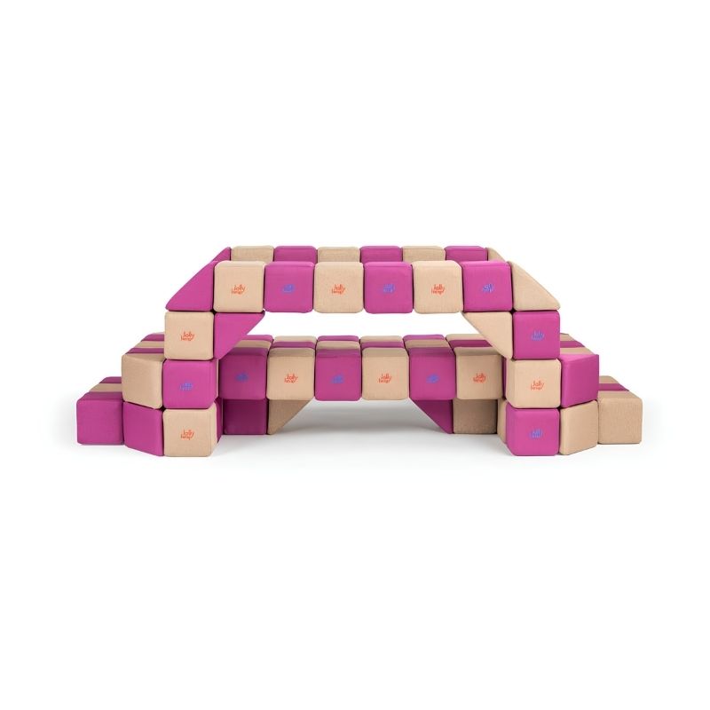 A two-level bridge built from JollyHeap Basic Set magnetic foam blocks, demonstrating the structural builds possible with this soft play set for schools and daycares.