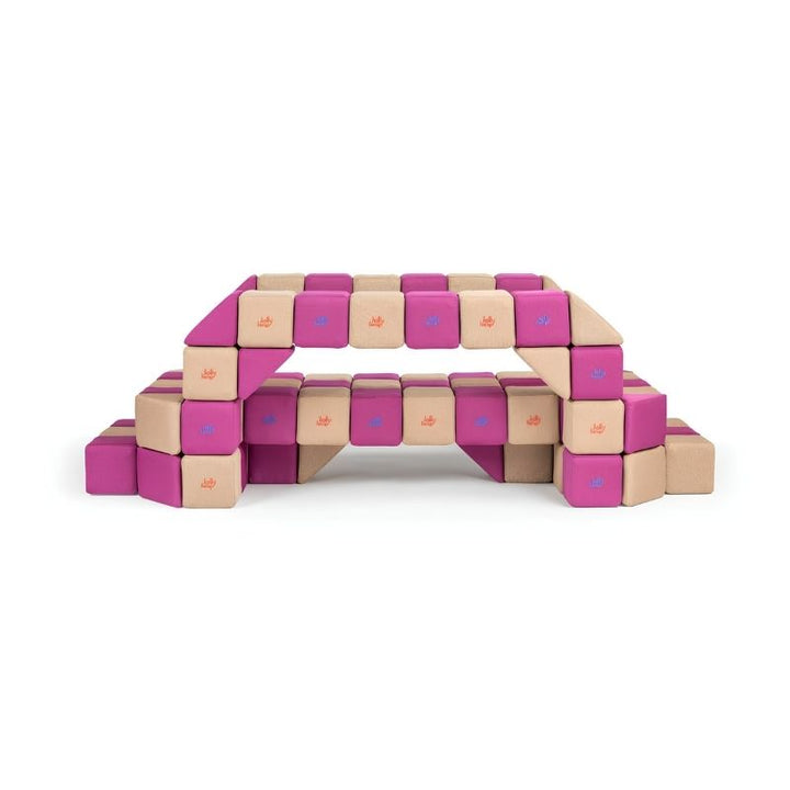 A two-level bridge built from JollyHeap Basic Set magnetic foam blocks, demonstrating the structural builds possible with this soft play set for schools and daycares.
