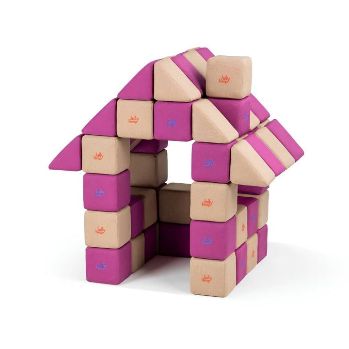 A peaked-roof house structure built entirely from JollyHeap Basic Set magnetic foam blocks, demonstrating the full-scale builds possible with this soft play set.
