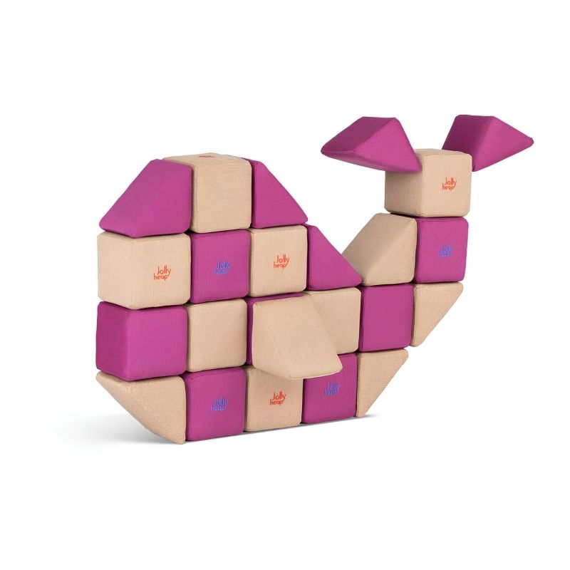 A whale-shaped figure built from JollyHeap Basic Set magnetic foam blocks, showing the animal builds children can create with this soft play block set.