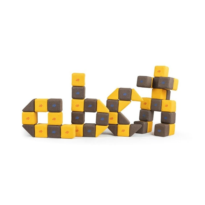 JollyHeap Medium Set magnetic soft blocks arranged into abstract letter and figure shapes side by side