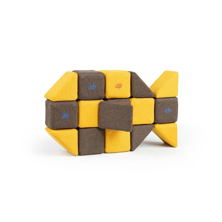 A close-up view of a fish shape built from JollyHeap Medium Set magnetic soft blocks, showing tail and body detail