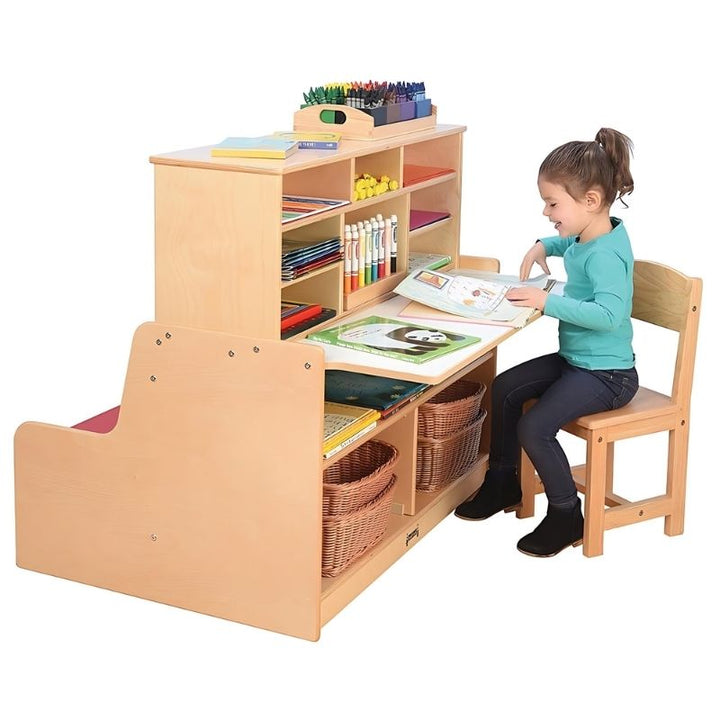 Child actively reading on the Jonti-Craft Literacy Station cushioned bench, demonstrating the comfortable two-seater reading space of this early literacy classroom furniture