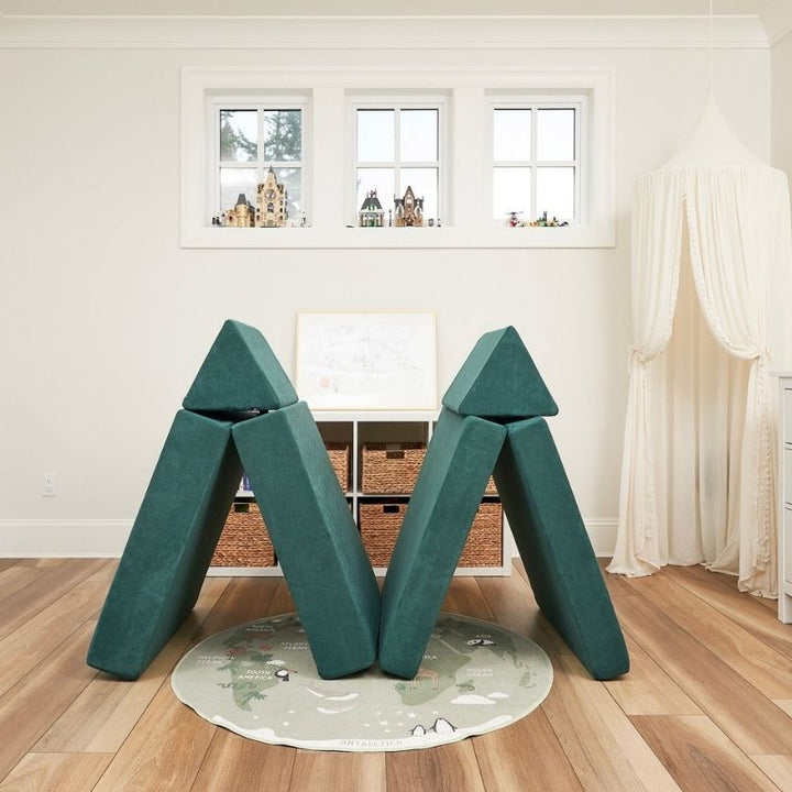 Angled view of the Kiddie Couch in Emerald Green built as a fort, showing the enclosed sensory play space the modular couch creates