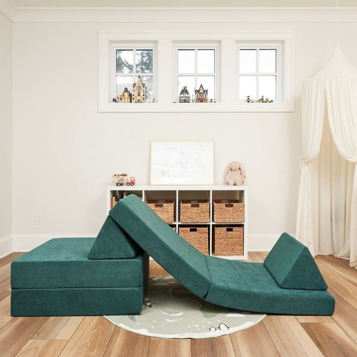 Kiddie Couch in Emerald Green arranged as a slide, providing vestibular input and active gross motor sensory play