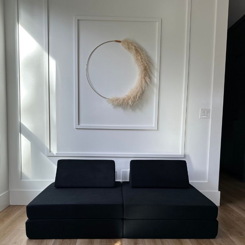 Front view of the Kiddie Couch modular play couch in Jet Black showing the assembled foam configuration with microvelvet cover