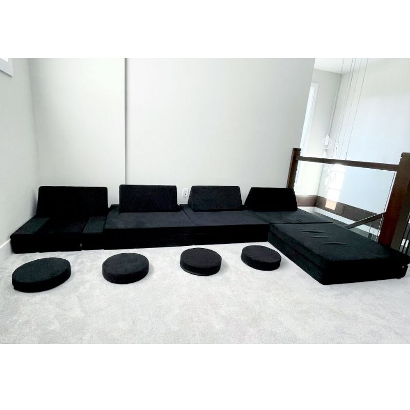 Kiddie Couch in Jet Black built into a large configuration in a spacious living room, showing gross motor play potential