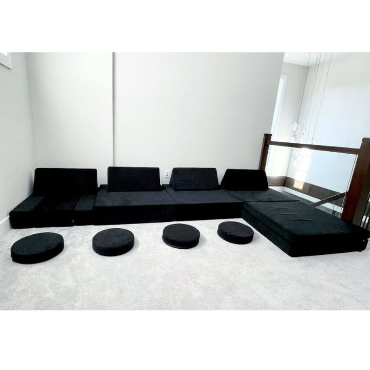 Kiddie Couch in Jet Black built into a large configuration in a spacious living room, showing gross motor play potential