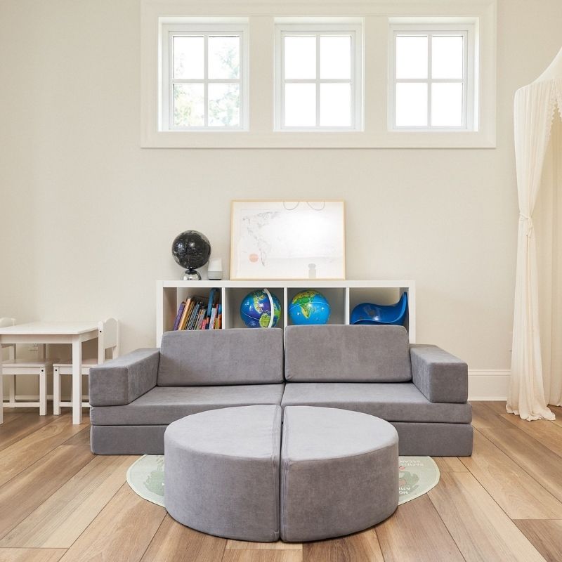 Kiddie Couch modular play couch in Koala Grey in a family living room, showing the couch in its standard seated configuration