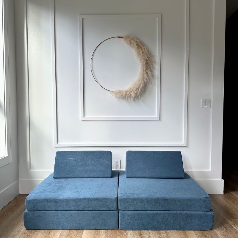 Front view of the Kiddie Couch modular play couch in Pacific Blue showing the full four-piece foam assembly