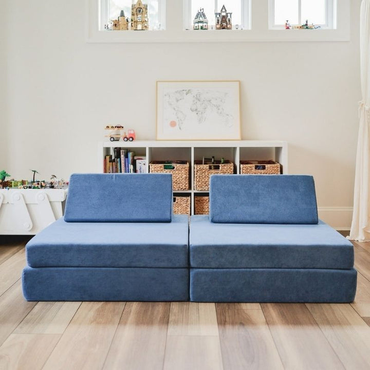 Front view of the Kiddie Couch in Pacific Blue in a family living room, showing the modular kids play couch as everyday home furniture