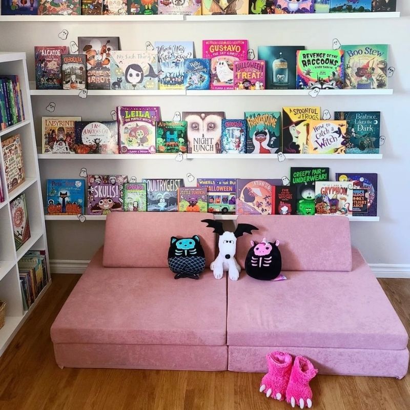 Landscape room view of the Kiddie Couch in Pink styled in a children's playroom environment