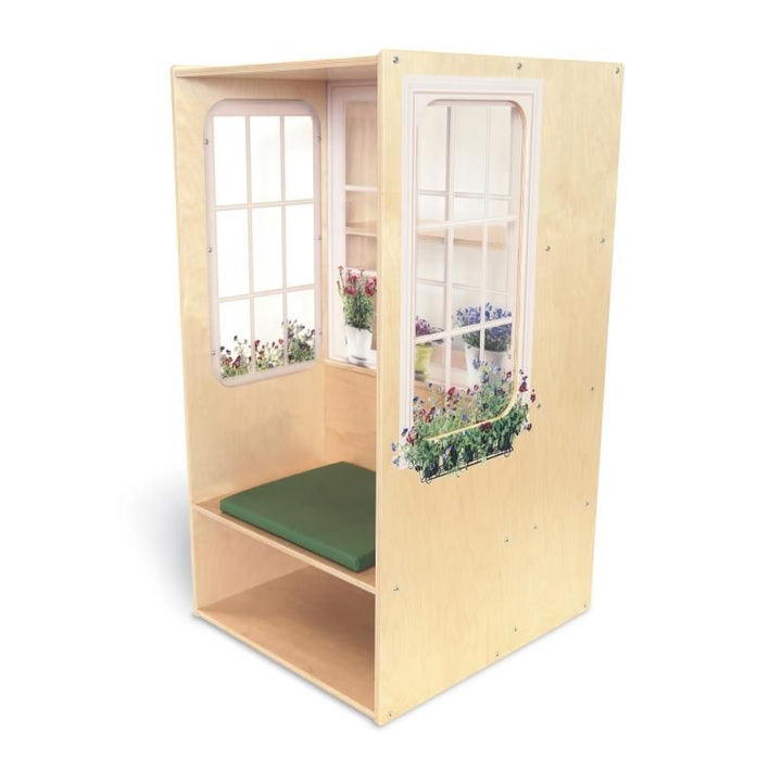 Whitney Brothers Nature View Window Seat kids reading nook with a green seat cushion, open under-seat storage, and acrylic windows showing potted plants and window box flowers