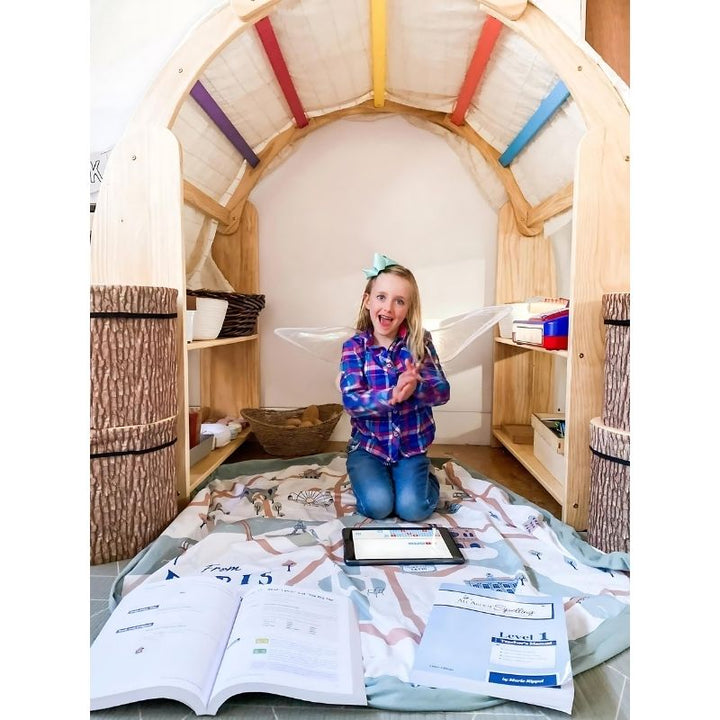 Child actively playing inside the Kinderhuis Aurora Waldorf Playstand, demonstrating open-ended imaginative play with the pine wood structure