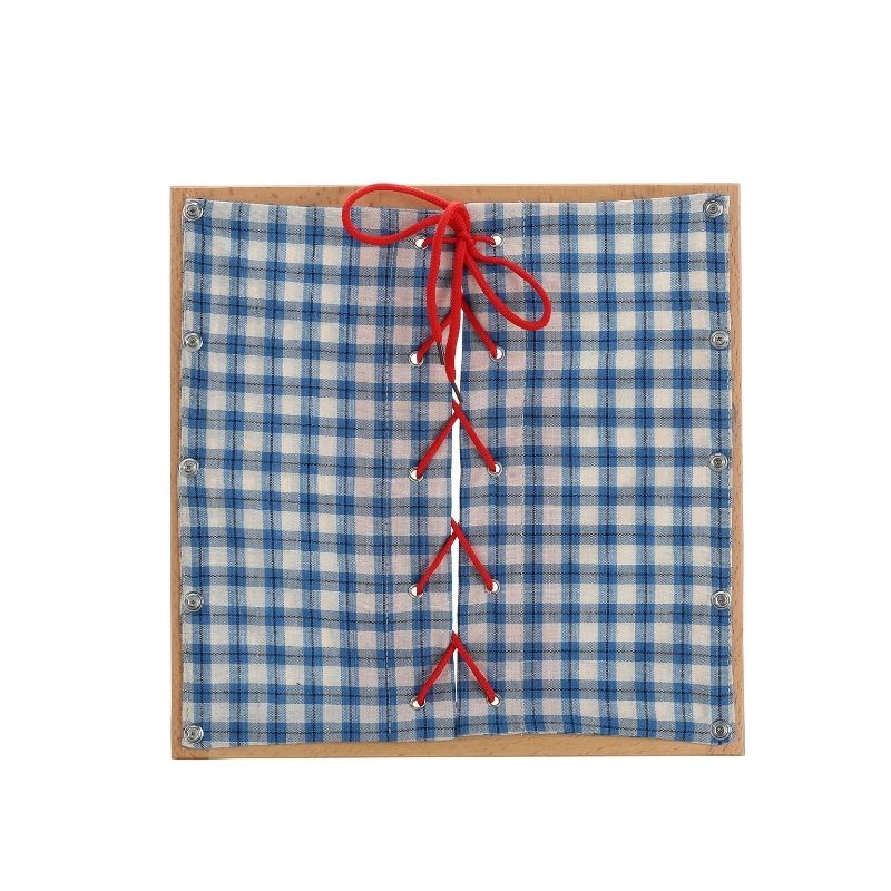 Kinderhuis Montessori dressing frame showing bow and knot closure, practical life material for self-dressing skill development