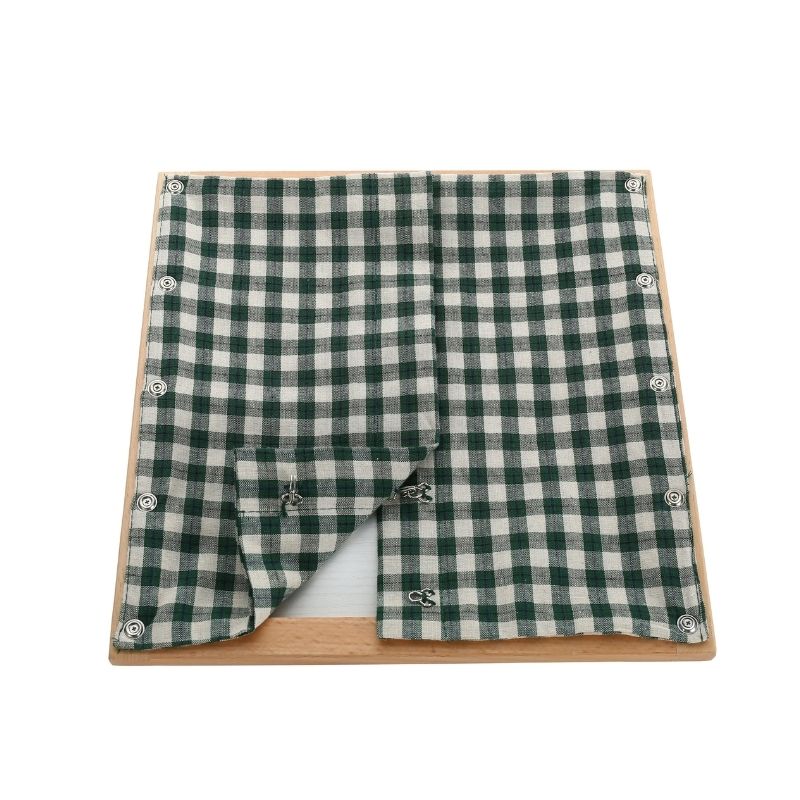 Kinderhuis Montessori dressing frame with green check textile panel, AMI-approved practical life material for children