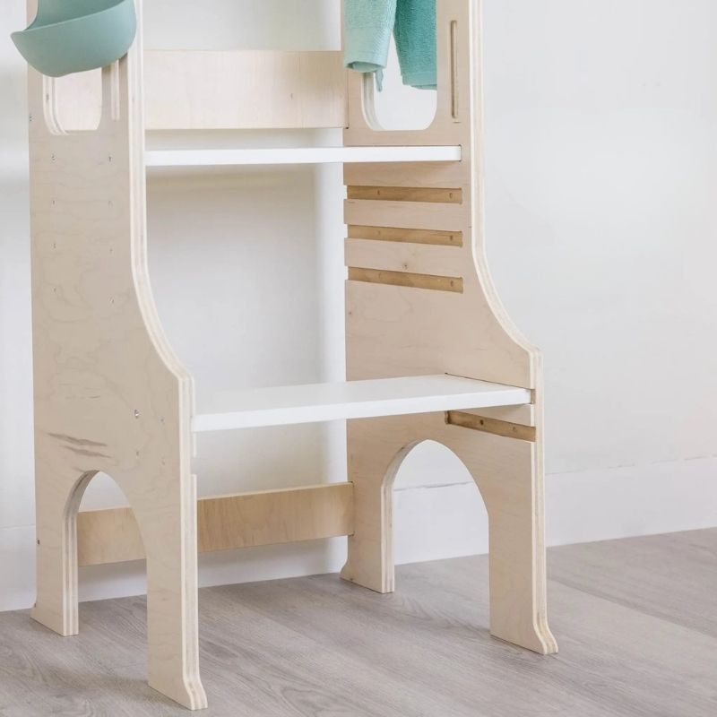 Sapiens Child Kiwi Kitchen Tower bottom view in an indoor home setting showing the sturdy non-balancing base and compact footprint of the Vancouver-made adjustable kitchen learning stool