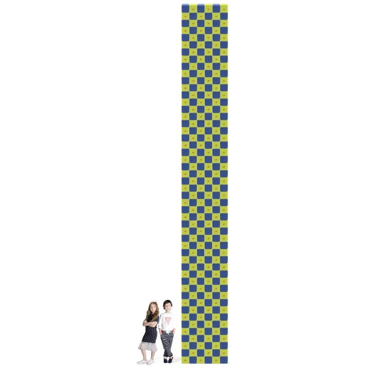 Two children stand beside a tall checkerboard tower built from the JollyHeap Fun Set large group magnetic building blocks, showing scale