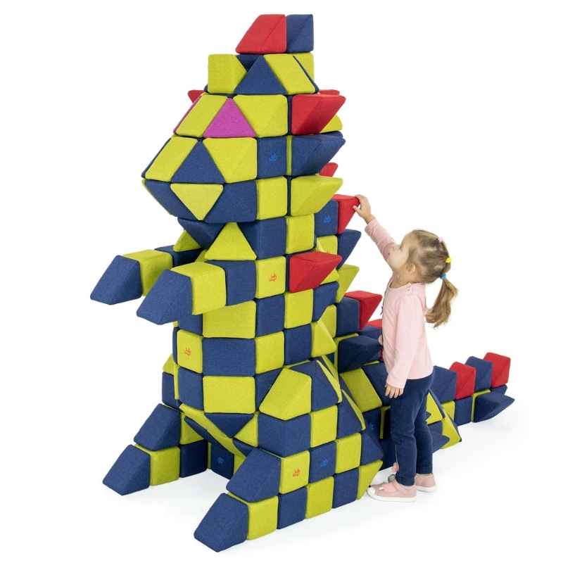 A child adds a red block to a Godzilla-style figure built from the JollyHeap Fun Set large group magnetic building blocks