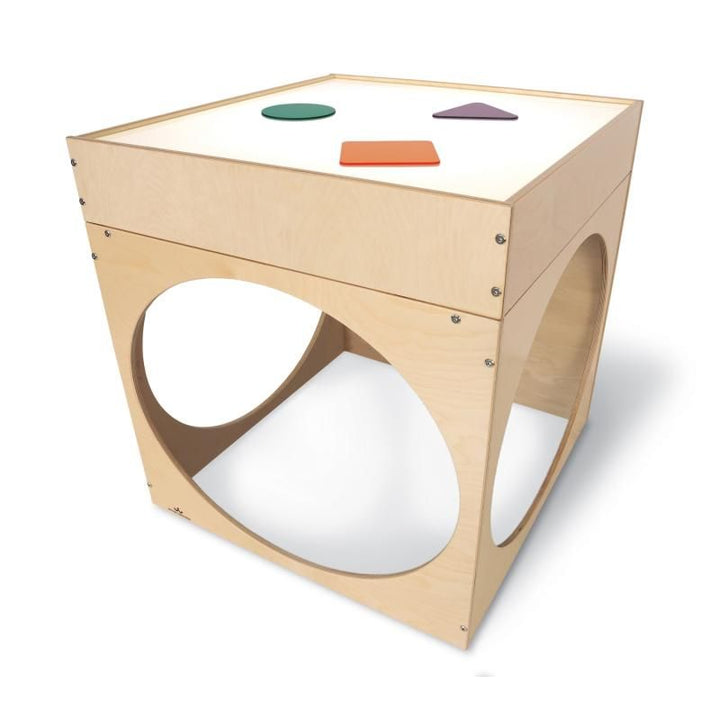 Whitney Brothers Superbright LED Creative Cube with green, purple and orange acrylic shapes on its illuminated LED light table, a light table reading cube for classrooms