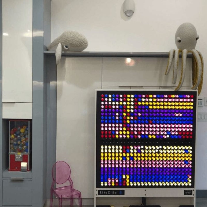 LiteZilla Giant Lite Brite installed in a school classroom setting, showing the interactive sensory light wall as a STEM and sensory tool