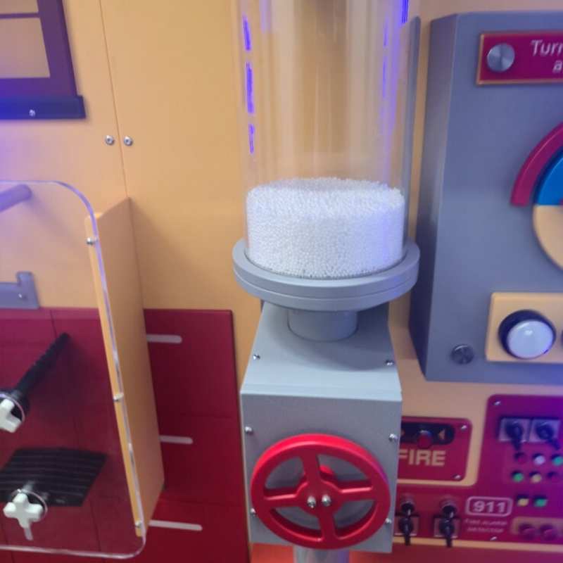 LiteZilla Hurricane Tube wall-mounted control wheel and clear acrylic column filled with lightweight foam elements