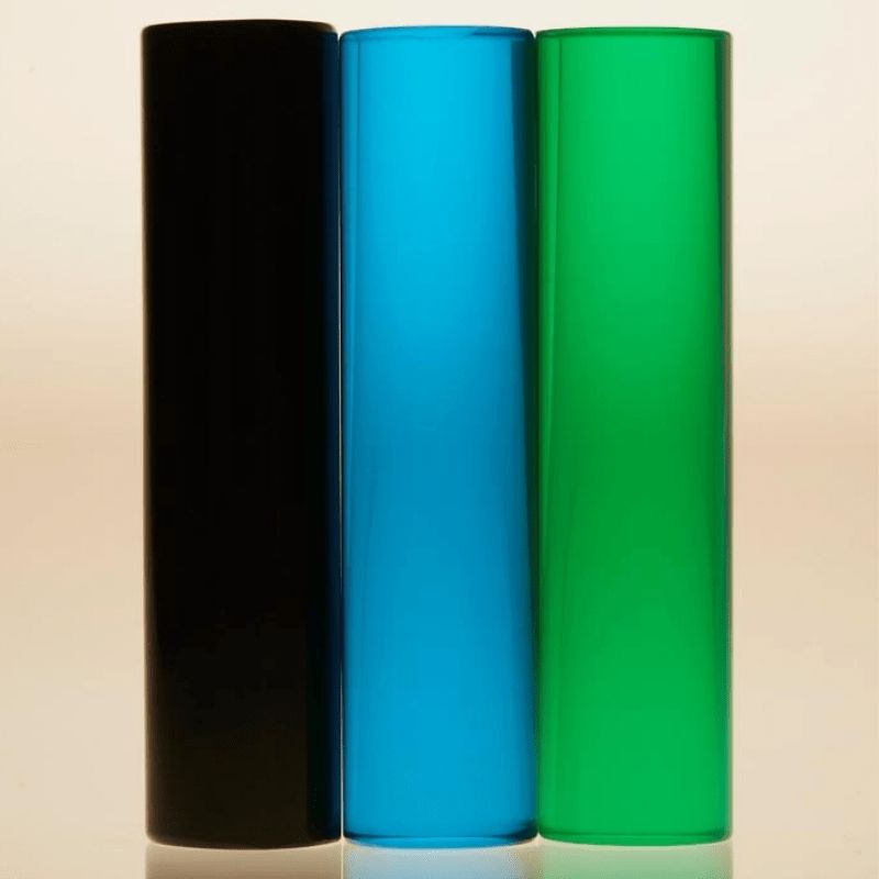 LiteZilla LitePins set showing Sea Blue, Opaque Black and Emerald Green acrylic pins for use in the LiteZilla Giant Lite Brite sensory light wall