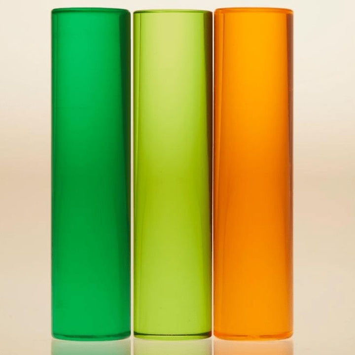 LiteZilla LitePins set showing Emerald Green, Jade Green and Tangerine Orange acrylic pins designed for the LiteZilla Giant Lite Brite light board