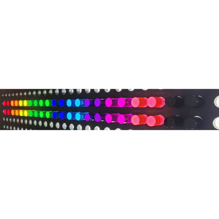 LiteZilla Mini LitePins inserted into illuminated grid showing glowing colour display - acrylic sensory pins for LiteZilla Mini and IllumiTable