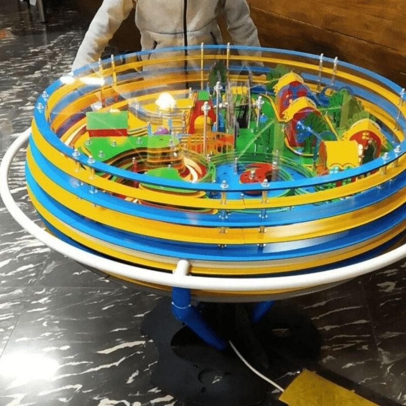 LiteZilla Twistopia Tabletop Labyrinth freestanding interactive maze with wraparound handlebar and themed lit pathways, a fine motor and sensory play exhibit for schools, clinics, and play spaces across North America