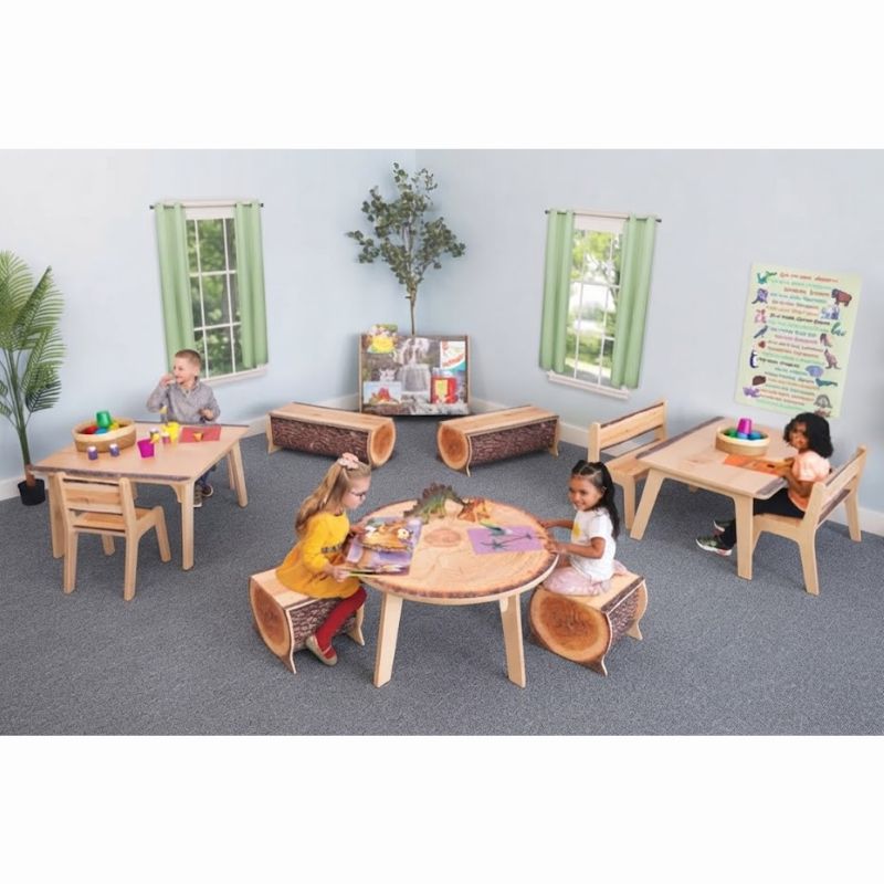 Children playing and reading at Whitney Brothers Nature View Live Edge Activity Tables in a biophilic preschool classroom with log stools and matching seating