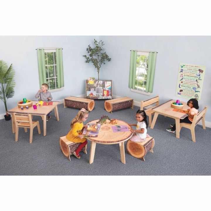 Children playing and reading at Whitney Brothers Nature View Live Edge Activity Tables in a biophilic preschool classroom with log stools and matching seating