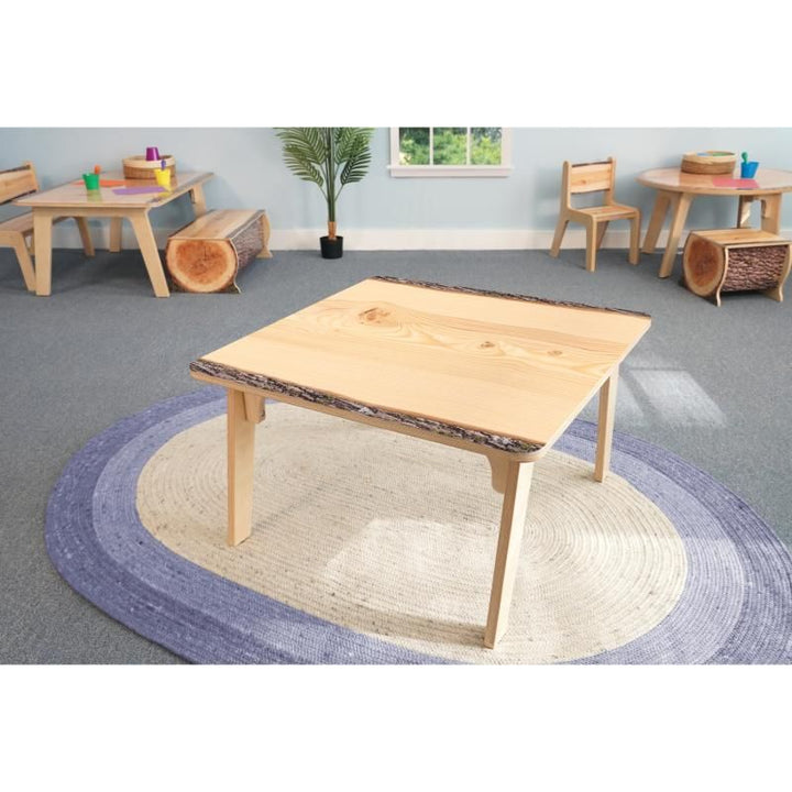 Whitney Brothers Nature View Live Edge Activity Table in square shape on a classroom rug, a nature-inspired kids table for small group learning centers