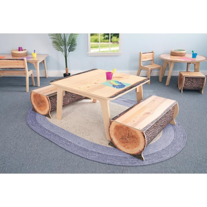 Whitney Brothers Nature View Live Edge Activity Table in square shape paired with log benches, a woodland-themed art and activity space for daycares