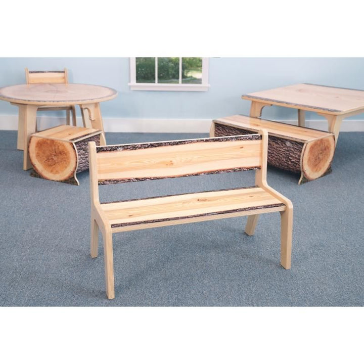 Whitney Brothers Nature View Live Edge Bench 12H in a nature-themed classroom with matching log seats and live edge tables