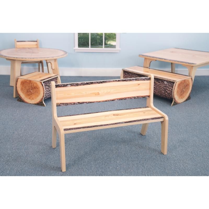 Whitney Brothers Nature View Live Edge Bench 12H in a nature-themed classroom with matching log seats and live edge tables