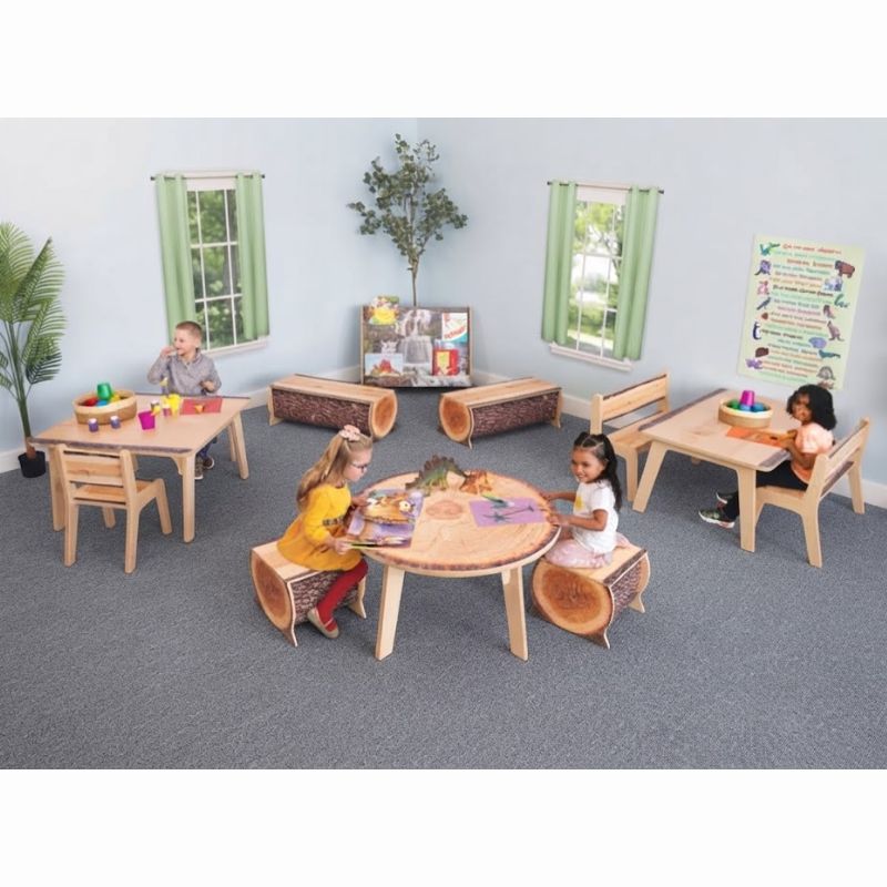 Children reading and playing at Whitney Brothers Nature View Live Edge tables, including the Live Edge Rectangle Table, in a nature-inspired preschool classroom
