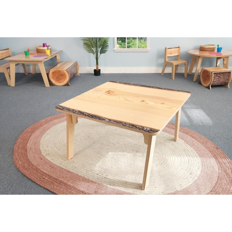 Whitney Brothers Nature View Live Edge Square Table in the 18 inch height on a round woven rug, a kids activity table for a nature-themed classroom
