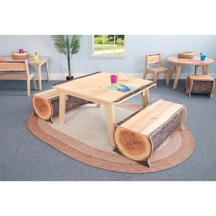 Whitney Brothers Nature View Live Edge Square Table 18 inch paired with Live Edge log benches, creating a biophilic reading and art activity area