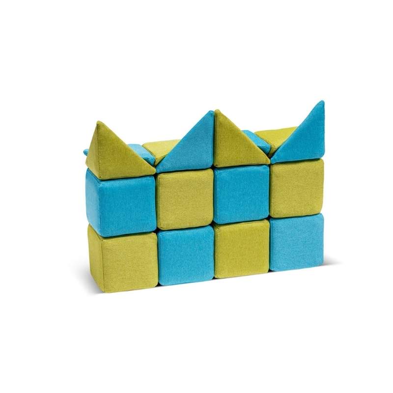 JollyHeap Extra 16 magnetic block expansion set built into a small wall structure, combining the new wedge and pyramid shapes with standard cubes for sensory building play