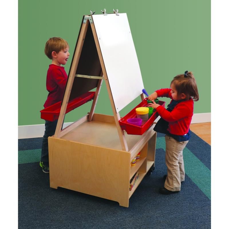 Two young children using the Whitney Brothers Mobile Art Center Two Station Set together, sharing a double-sided kids art easel with paint cups in the adjustable paint tray