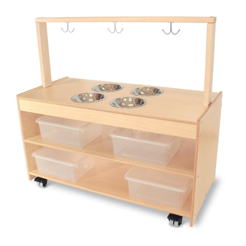 Whitney Brothers Mobile Sensory Play Kitchen showing four recessed stainless steel bowls, three double-prong hooks and four clear storage bins on a birch mobile sensory table