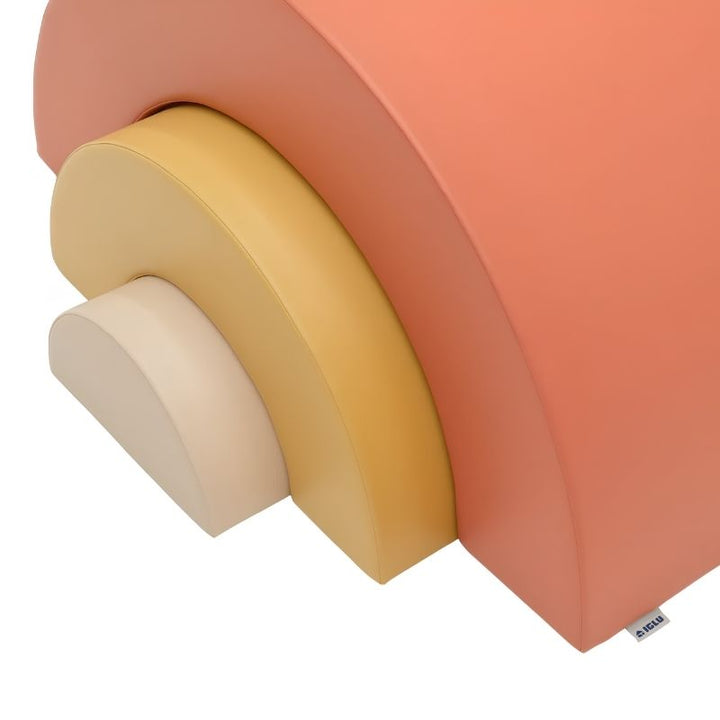 Close-up of the IGLU Rainbow Montessori Soft Play Set foam arch bridge showing the stitched IGLU brand tag