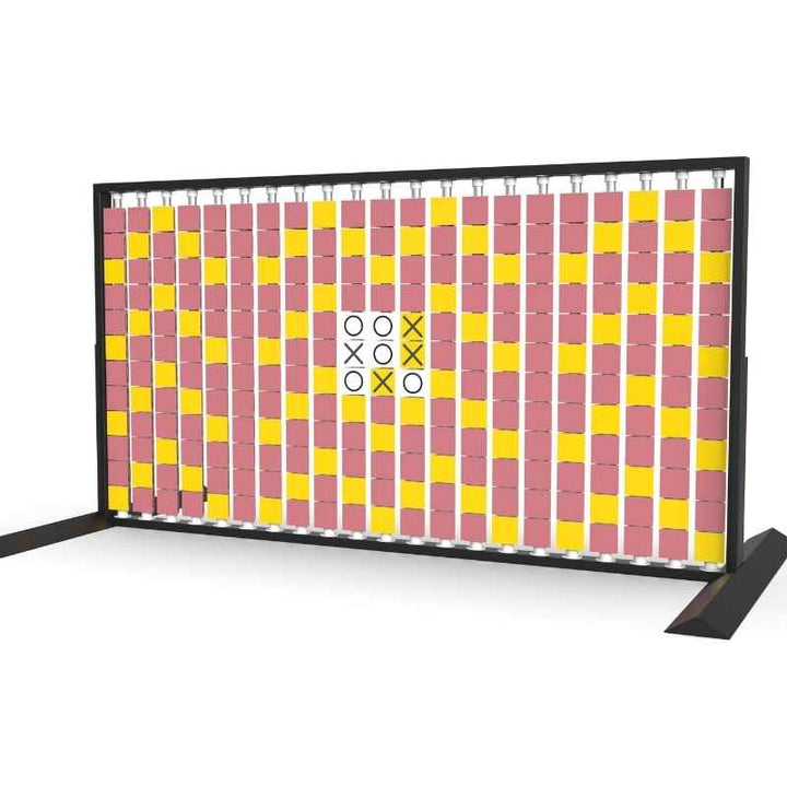 Angled view of the LiteZilla Mosaico Wall freestanding rotating wall panel with a built in tic tac toe game on yellow, pink and white triangles