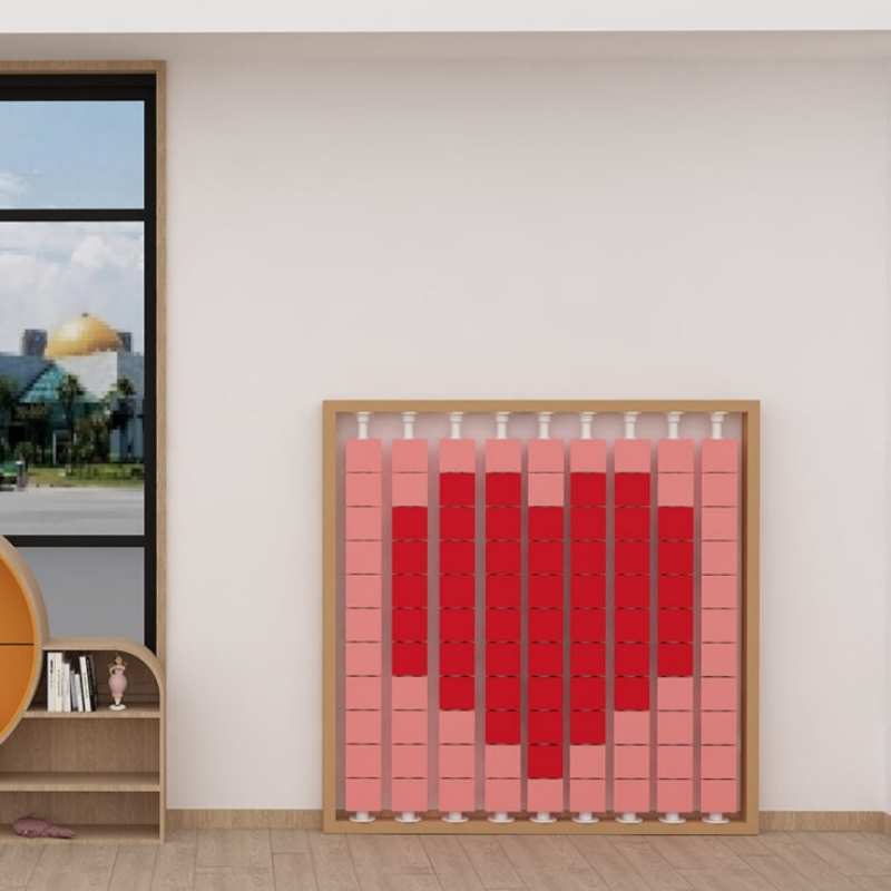 LiteZilla Mosaico Wall rotating wall panel displaying a heart pattern in pink and red square tiles for schools and sensory rooms