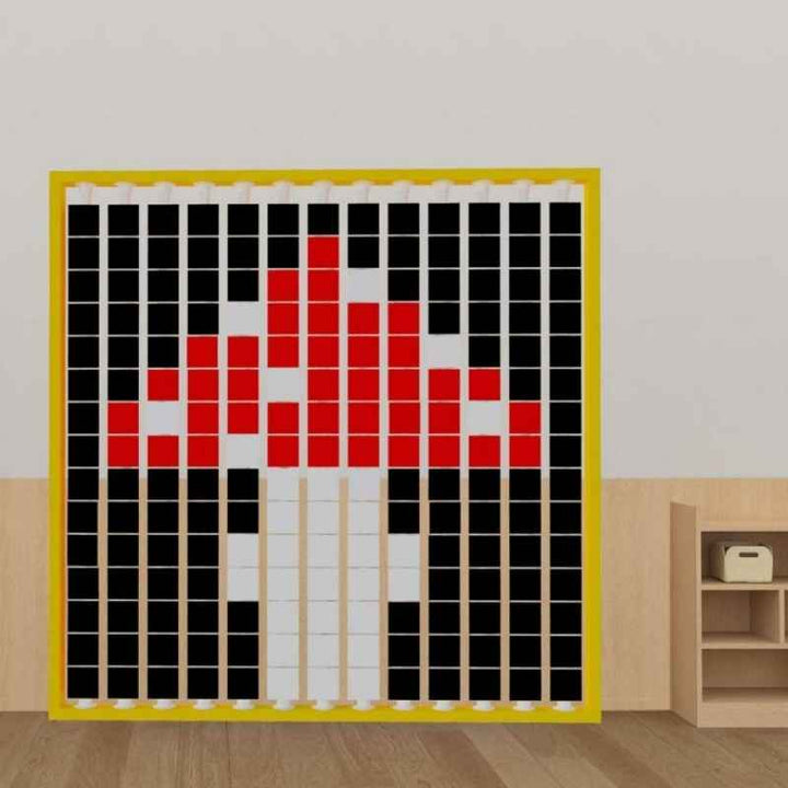 LiteZilla Mosaico Wall rotating wall panel forming a maple leaf pattern in black, red and white tiles for schools and sensory spaces across North America