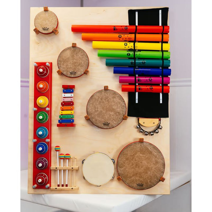The TFH Percussion Junction Wall Panel mounted alone, showing drums, boomwhackers, xylophone, tambourine and sleigh bells on one musical instrument wall panel