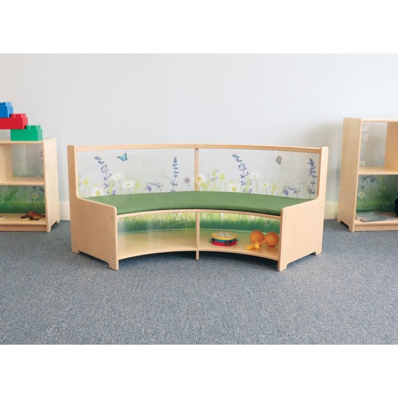 Whitney Brothers Nature View Curved Sofa curve-in style with a green seat cushion and book storage in a classroom reading nook